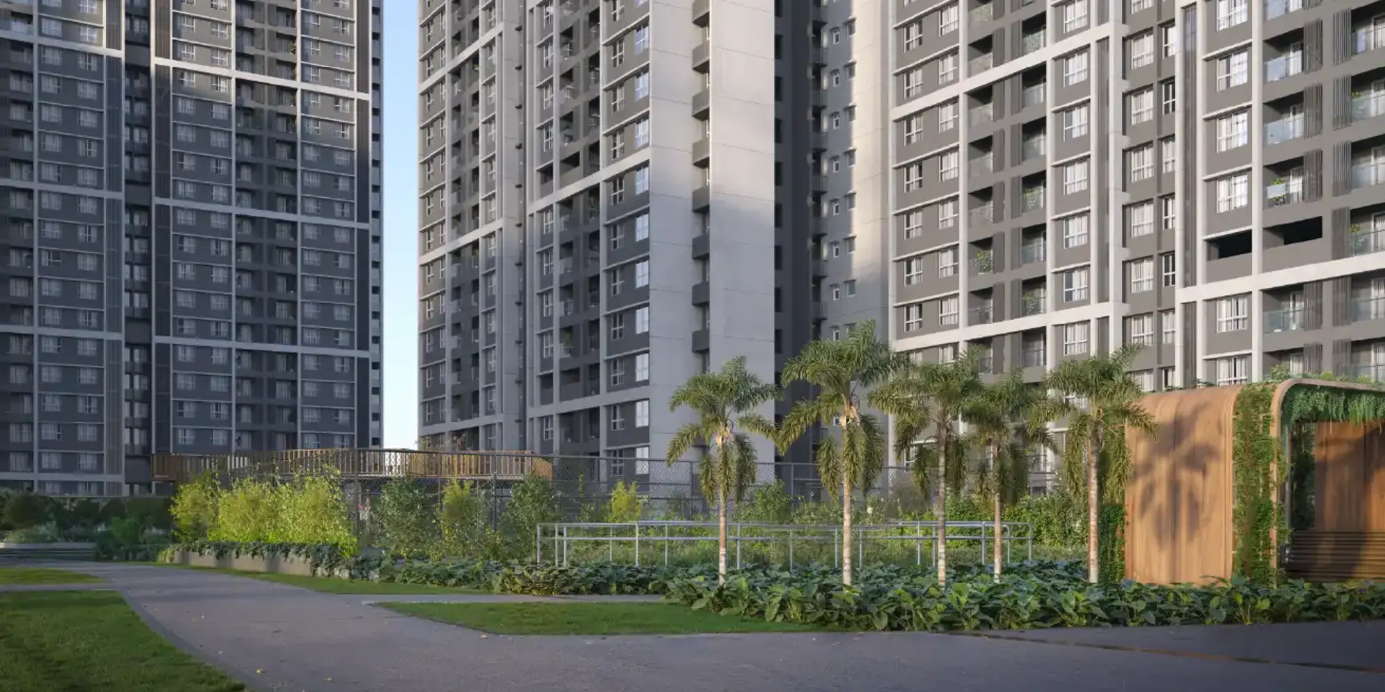 Landscaped greens and towers at Godrej Ivara